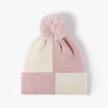 Gorro de punto con bloques de color y pompón