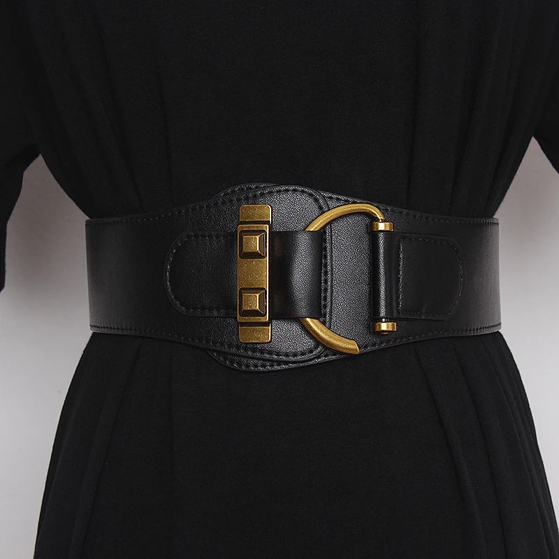 Wide gold-buckle belt styling reference