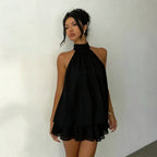 Robe d'été ajustée dos nu à licou et taille nouée, avec jupe courte bouffante pour femme