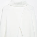 Pull en maille ample à col montant, fendu et de couleur unie