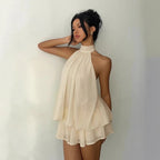 Robe d'été ajustée dos nu à licou et taille nouée, avec jupe courte bouffante pour femme
