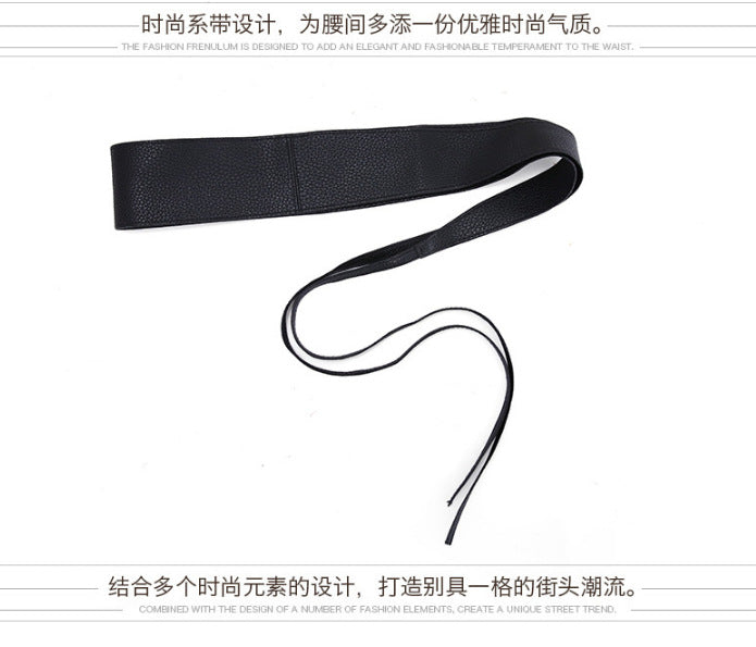 Black obi belt laid flat showing width