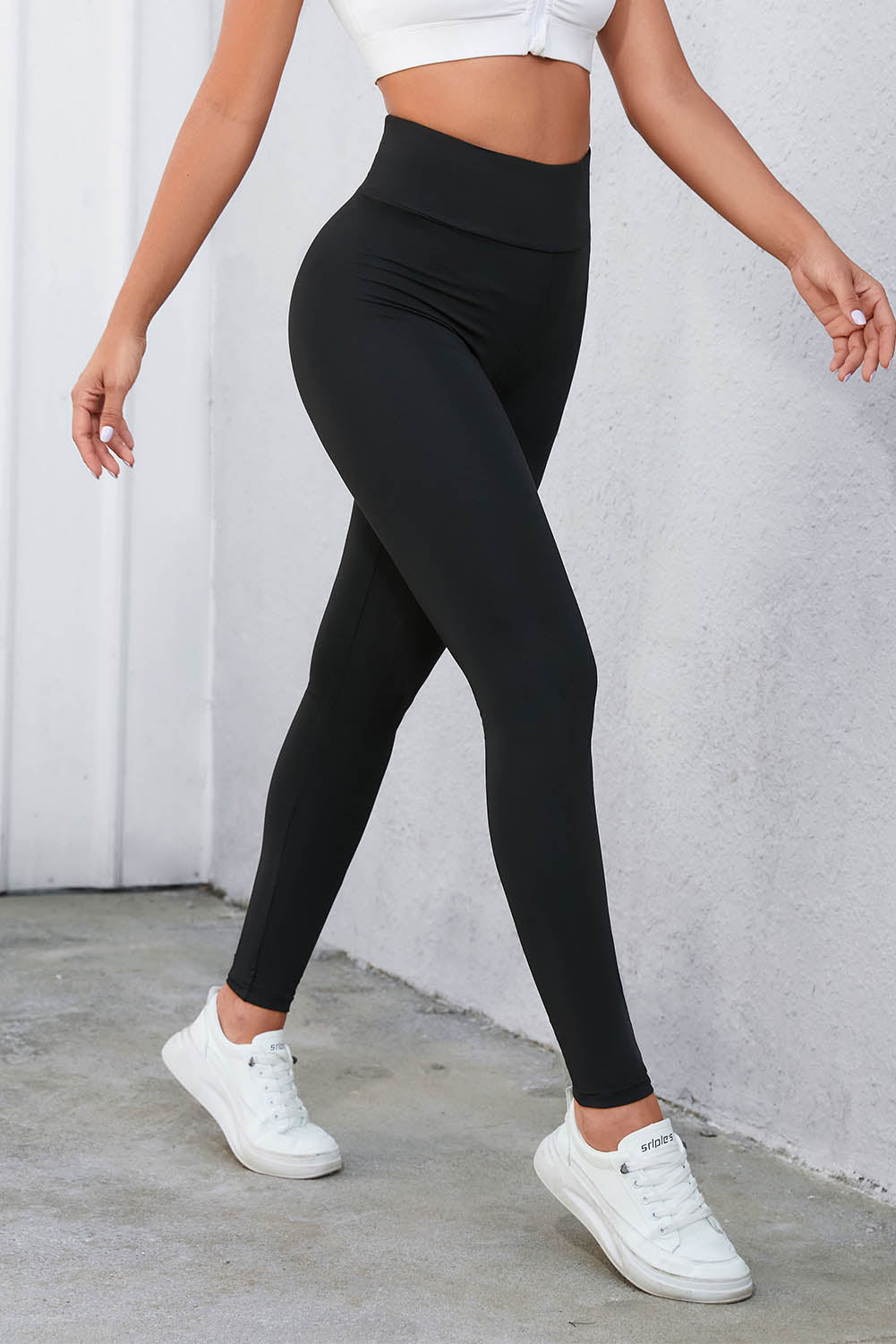 Leggings de cintura alta cruzados negros con control de abdomen