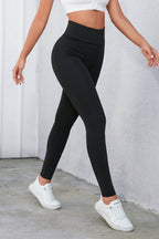 Leggings de cintura alta cruzados negros con control de abdomen