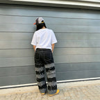 Pantalon en jean streetwear patchwork noir et gris à ourlet brut
