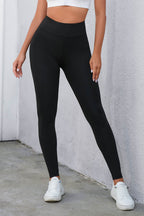 Leggings de cintura alta cruzados negros con control de abdomen