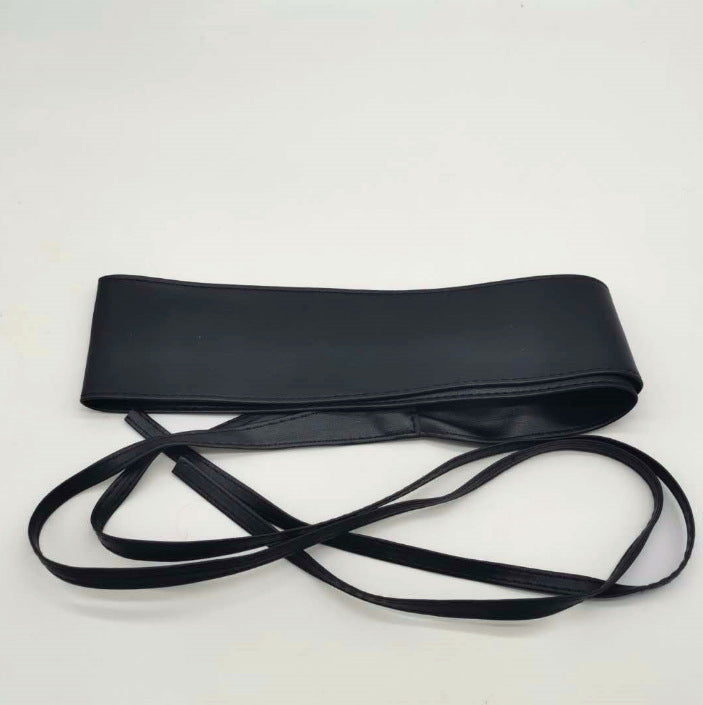Obi waist belt worn over a coat