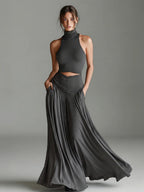 Ensemble deux pièces style top sans manches col montant et élégante robe longue