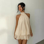 Robe d'été ajustée dos nu à licou et taille nouée, avec jupe courte bouffante pour femme