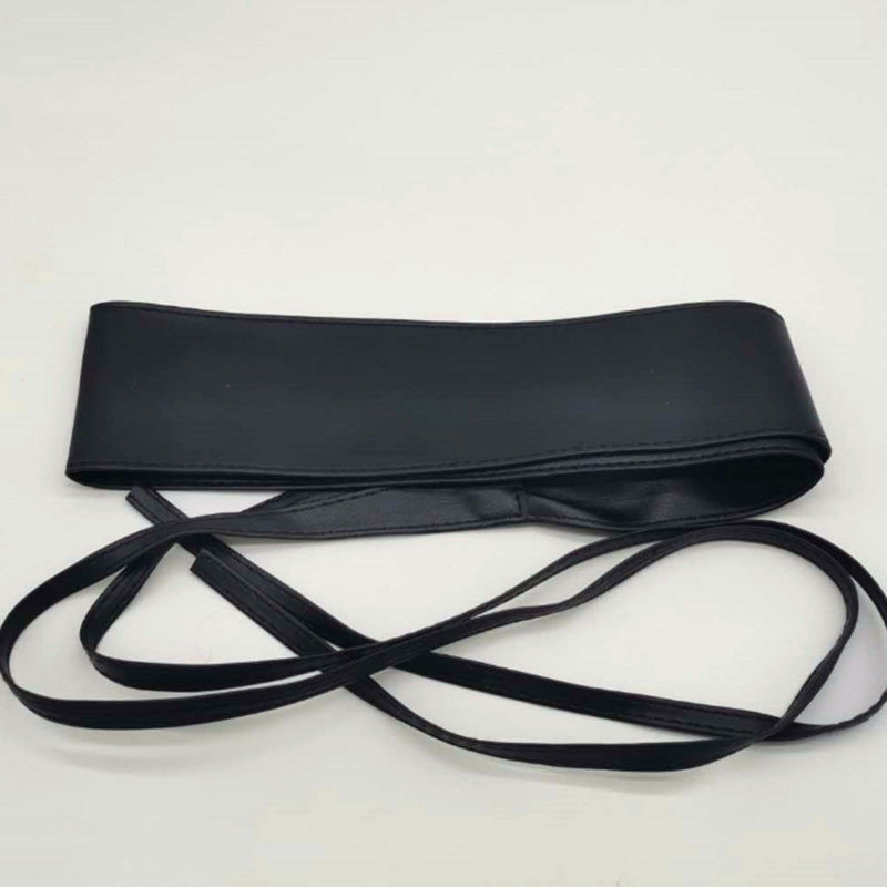 Obi waist belt tied in a bow at the waist