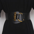 Gold-buckle waist belt detail view