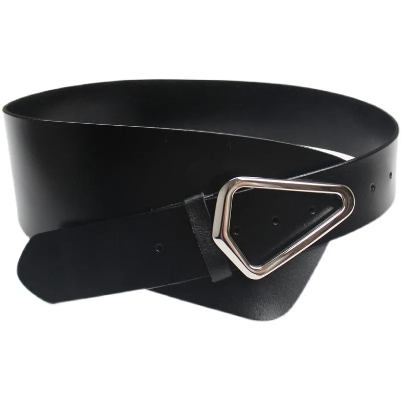 Wide waist belt styled over an oversized shirt